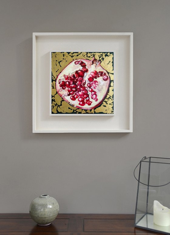 Pomegranate fruit in gold