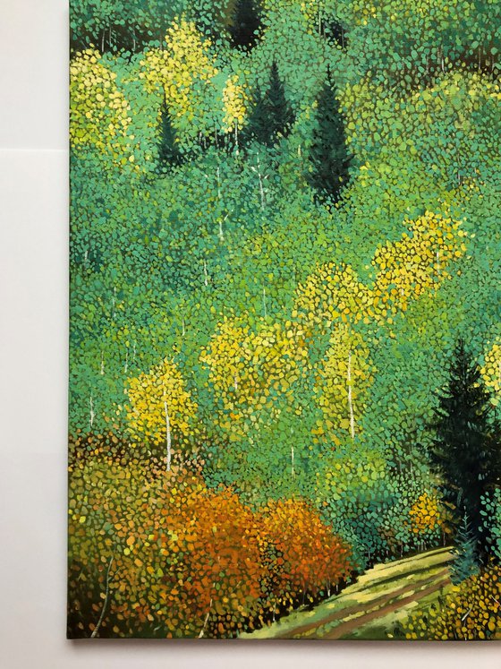 Green forest with yellow aspens