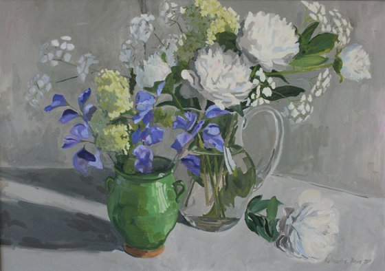 White peonies and blue sweet peas in three vases