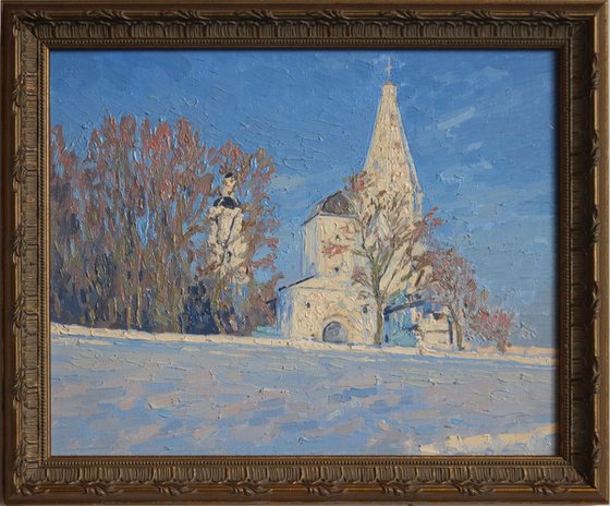 Frosty evening. View of the water tower and the Church of the Ascension