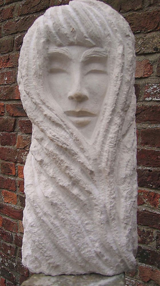 Serenity enclosed; stone carving