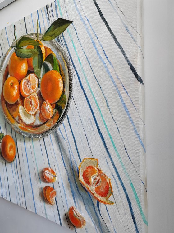 Clementines on stripen tablecloth