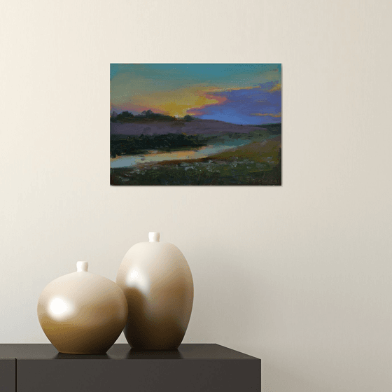 “Sunset over a calm river”