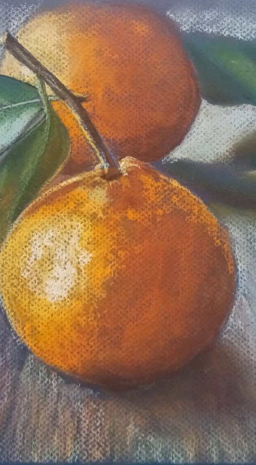 Ripe tangerine with a green leaf by Liubov Samoilova