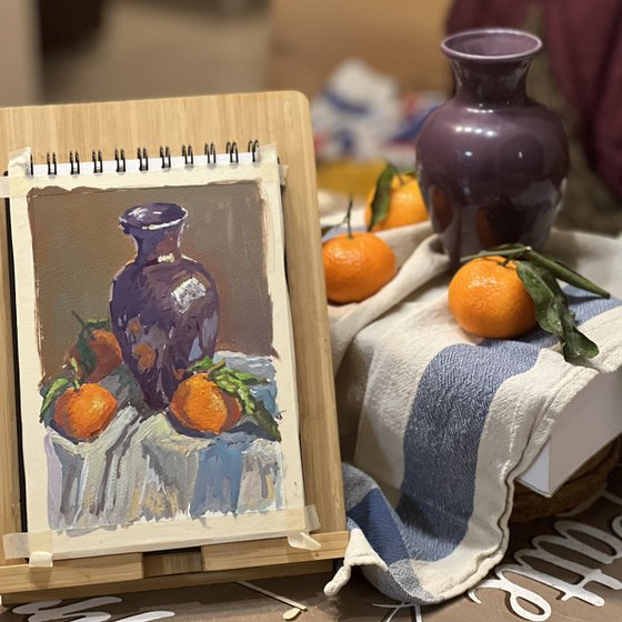 Oranges with a purple vase