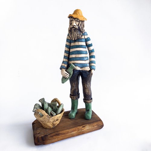 Good Cach (The Fisherman). Ceramic sculpture by Izabell Nemechek