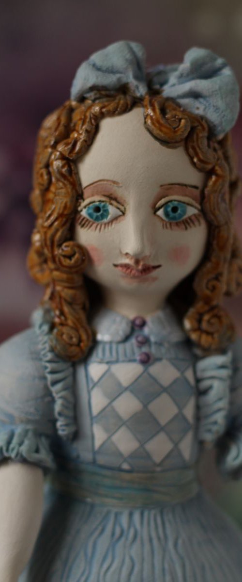 From the Alice in Wonderland. Alice as a little girl.  Wall sculpture by Elya Yalonetski by Elya Yalonetski