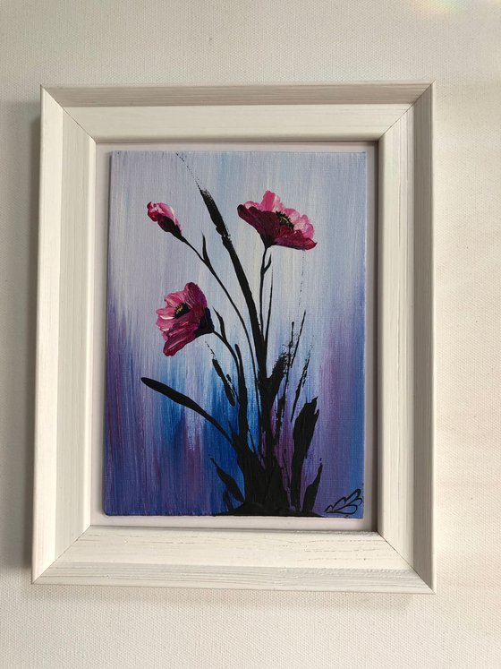 Pink poppies in a frame