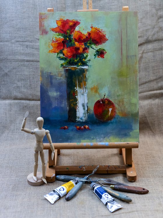 Still life with roses and apple.