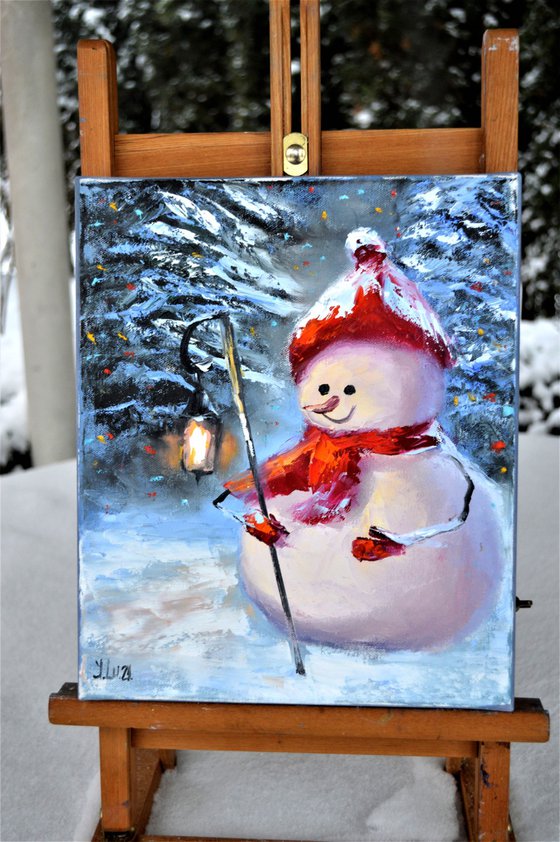 Snowman with a flashlight