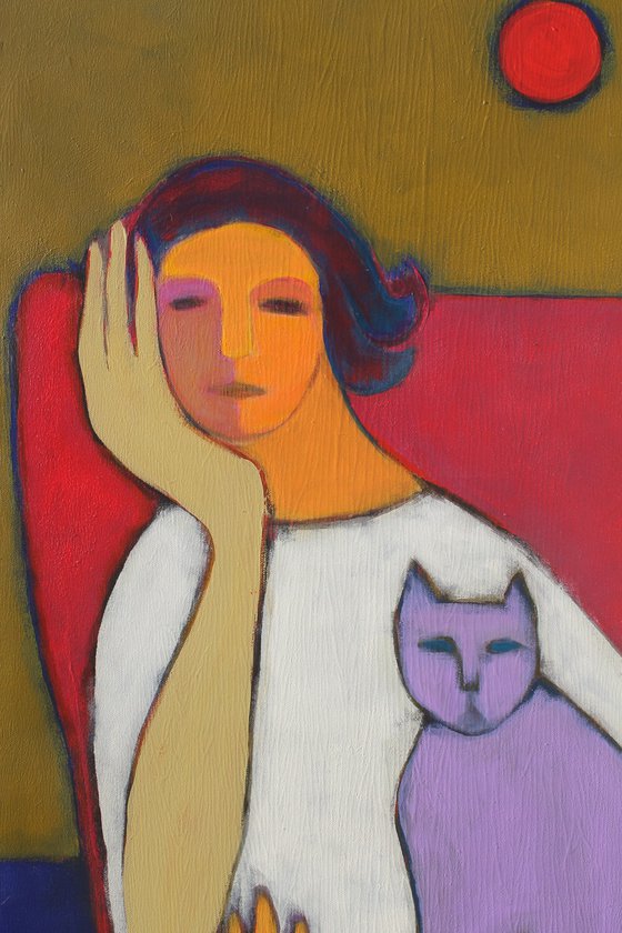 Portrait in a red chair.