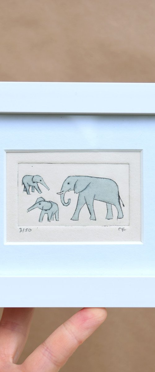 Small framed elephant and two young above and below by Sally Fisher