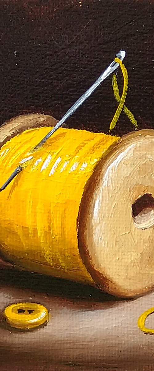 Little yellow cotton reel with button still life by Jane Palmer Art
