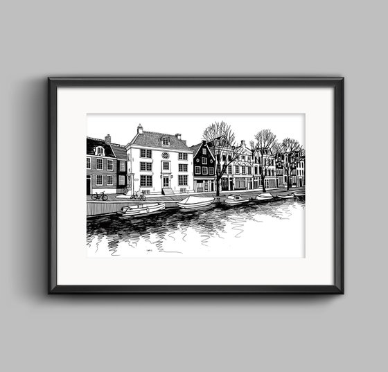 Boats and houses on a canal of Amsterdam, Netherlands.