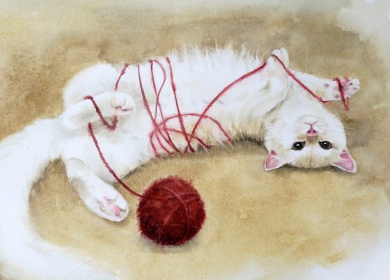 White Cat Playing with Ball of Yarn