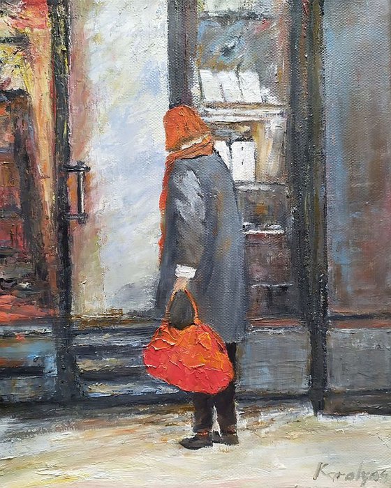 The woman with red bag