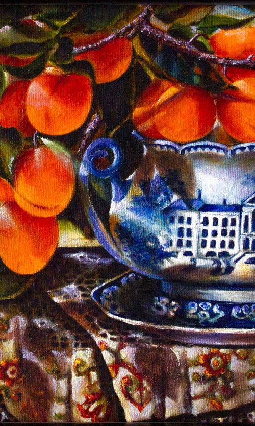 Apricot branch in a porcelain bowl by Inga Loginova
