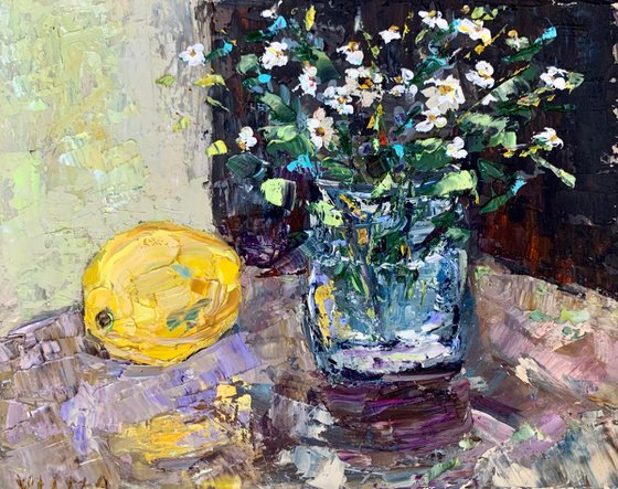 Still life with wildflowers and a lemon