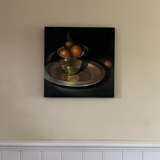 Kumquats in a gold bowl