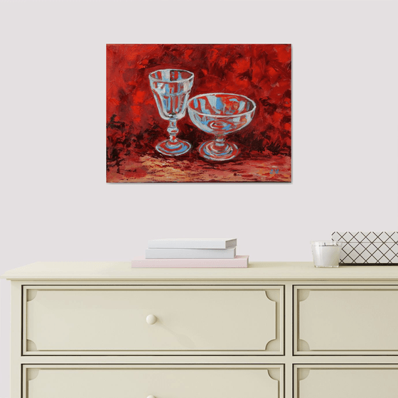 Wine glass on red.