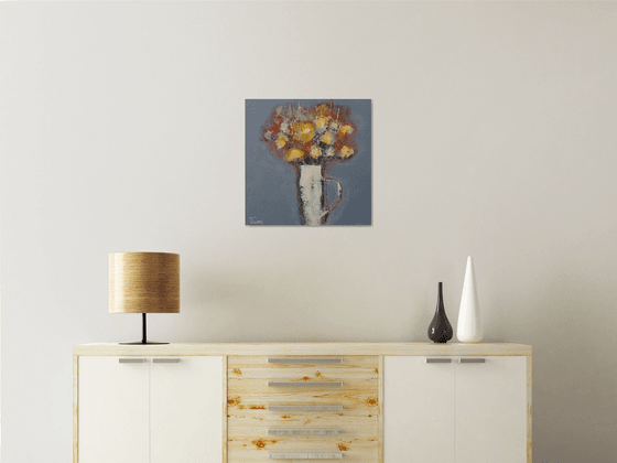 Flowers in a white jug.