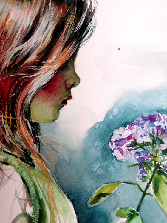Little girl with purple flower