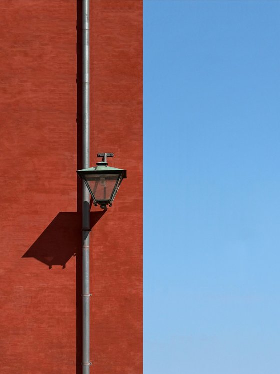 Red wall with a lamp