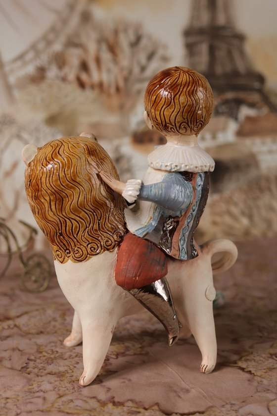 Vintage dressed boy riding a lion. From "Le Carousel, Hommage à l'Innocence" project by Elya Yalonetski