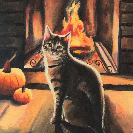 Cat in a cozy autumn fireplace