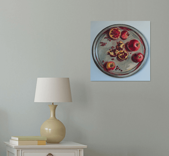 Pomegranates on metal try