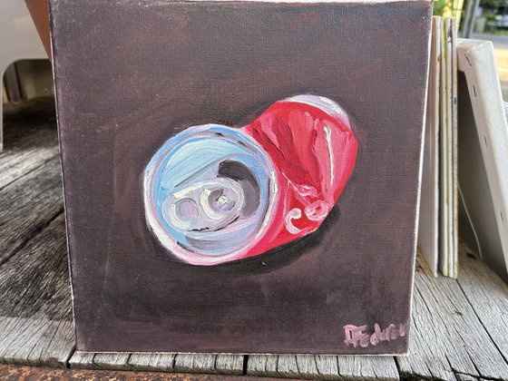 A crushed cola can