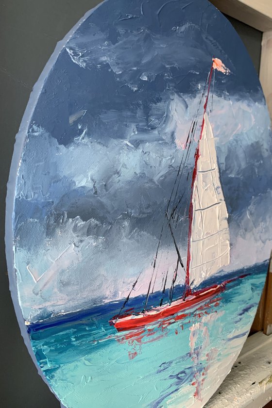 Red sail boat.