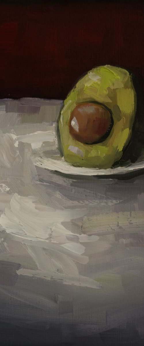 Avocado with plate. by Damien Venditti