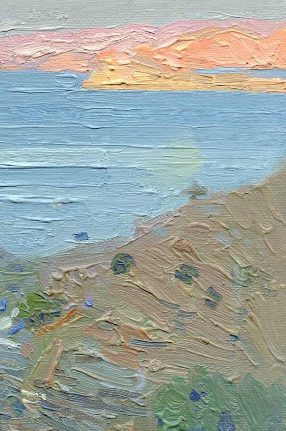 A lonely white sail gleams