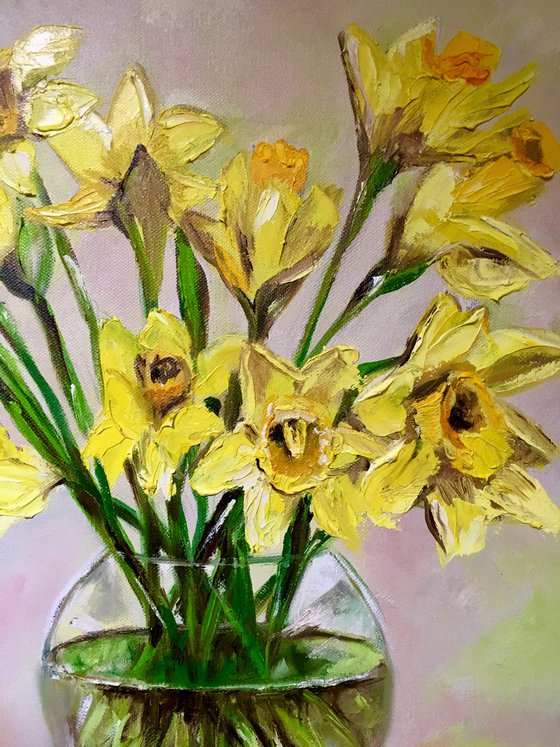 Bouquet of Daffodils on wood  table, still life inspired by spring in a glass.