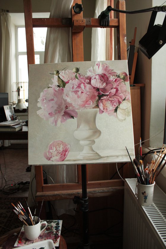 Bouquet of peonies in a white vase