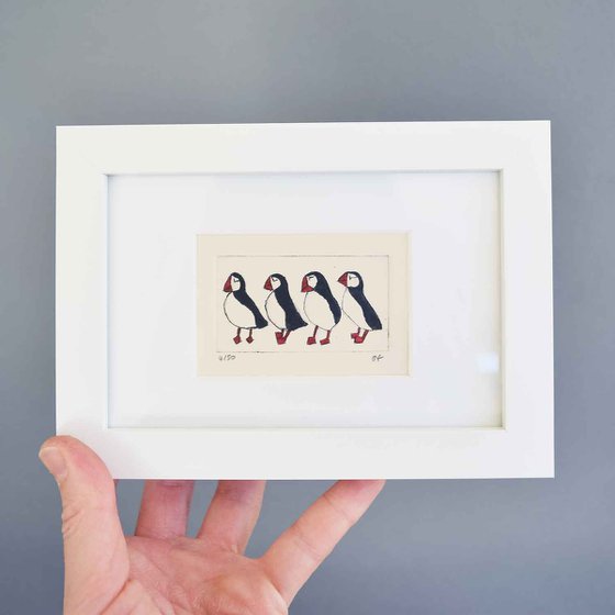 Small framed four puffins
