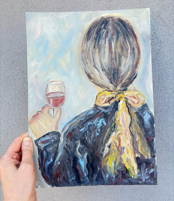 A Woman Holding a Glass of Wine