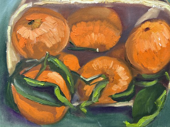 Tangerines in a wooden basket