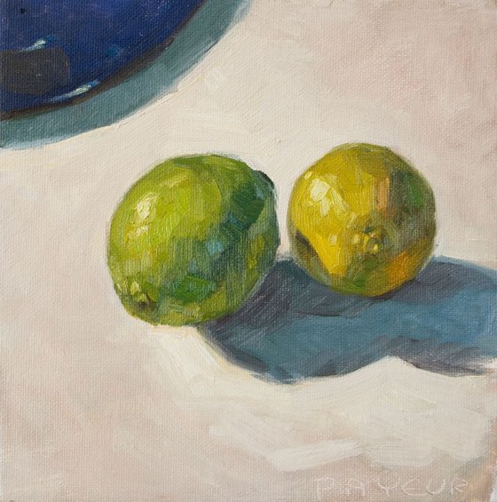 modern still life of green lemons