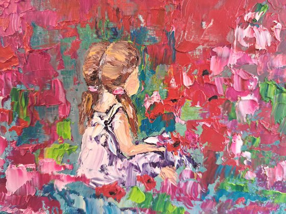 Girl in a  pink flower meadow