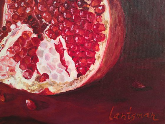 Ripe pomegranate with seeds still life