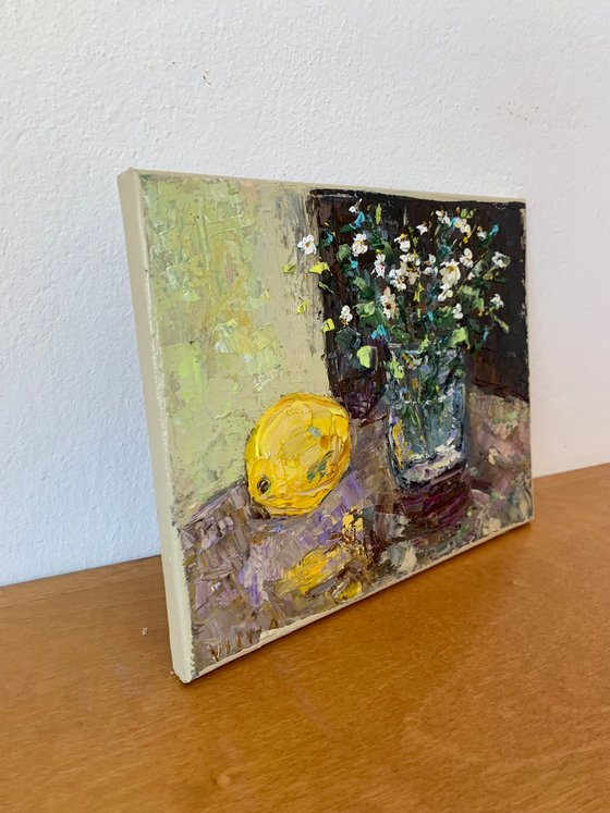 Still life with wildflowers and a lemon