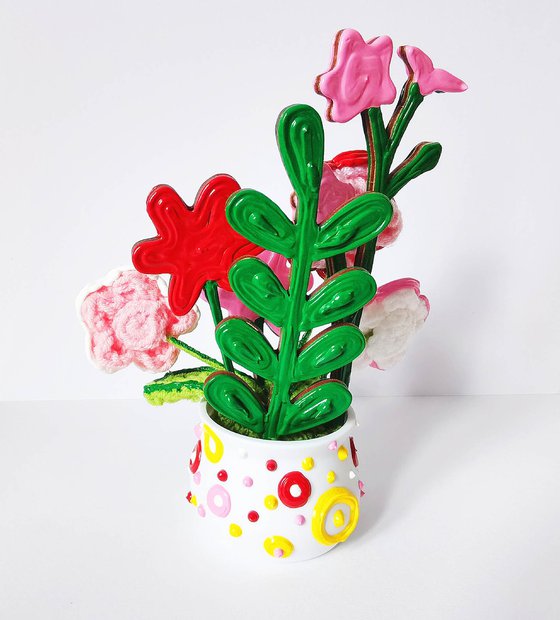 Knitted flowers in vase