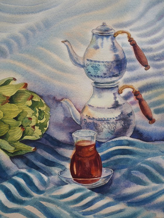 Turkish still life with tea and artichoke on a striped towel