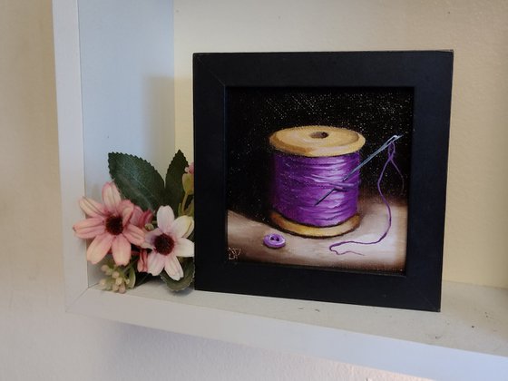 Little Purple  cotton reel  still life