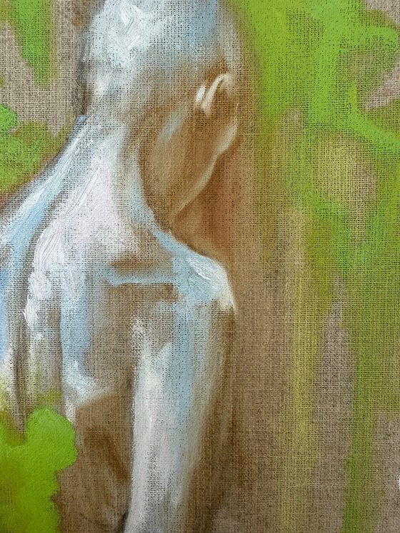 figure with green bushes