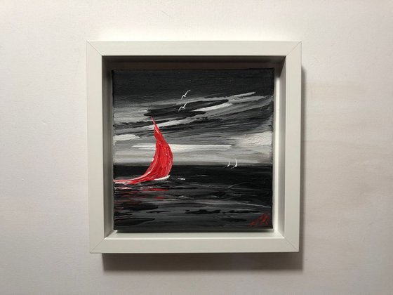 Red sail in a storm