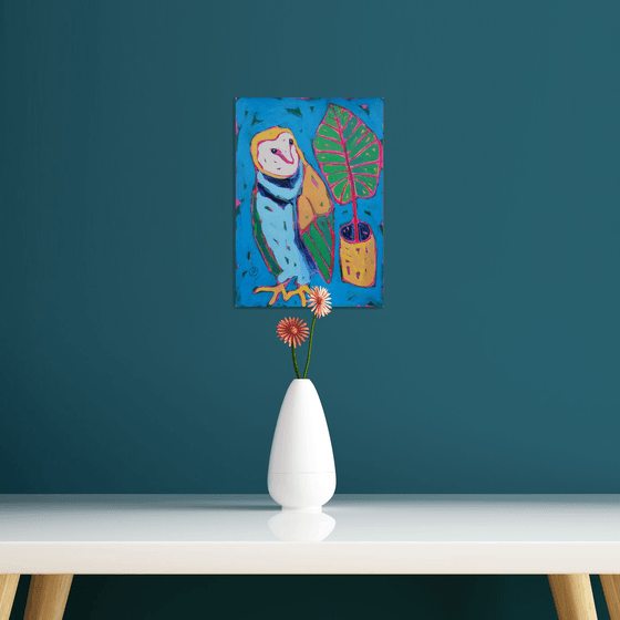 Owl and palm leaf
