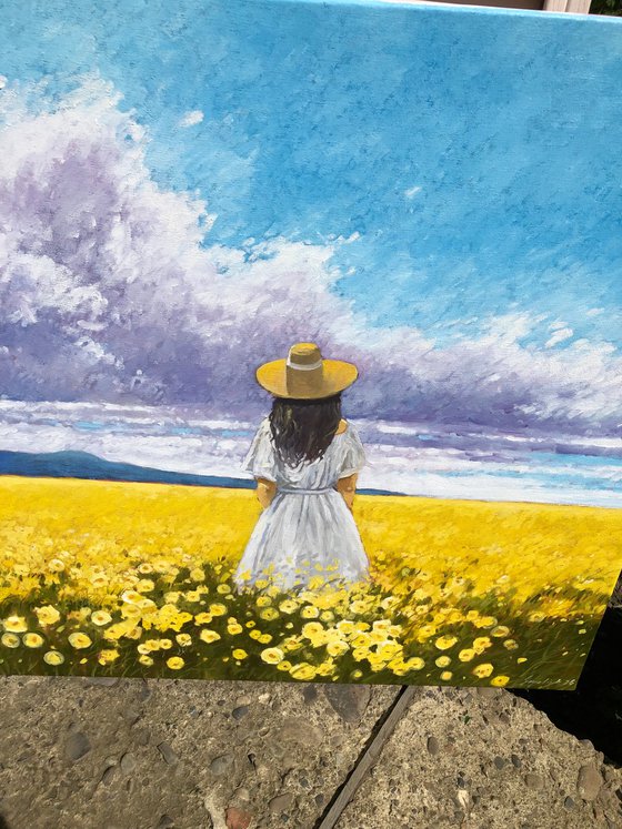 Summer. Woman in flower field
